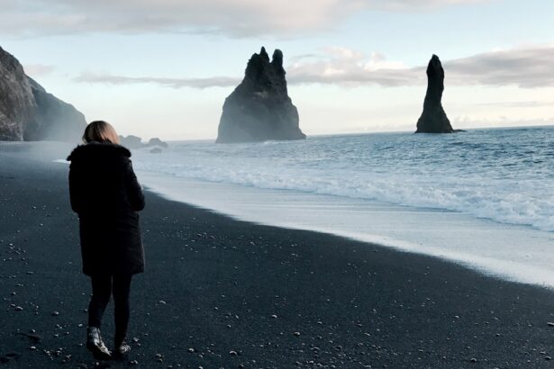 person walking near body of water