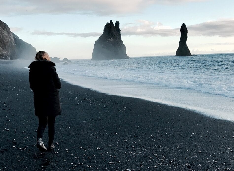 person walking near body of water