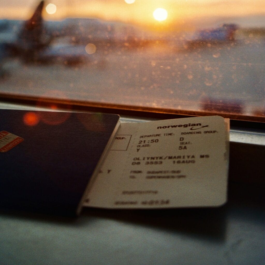 white printer paper on glass window during sunset