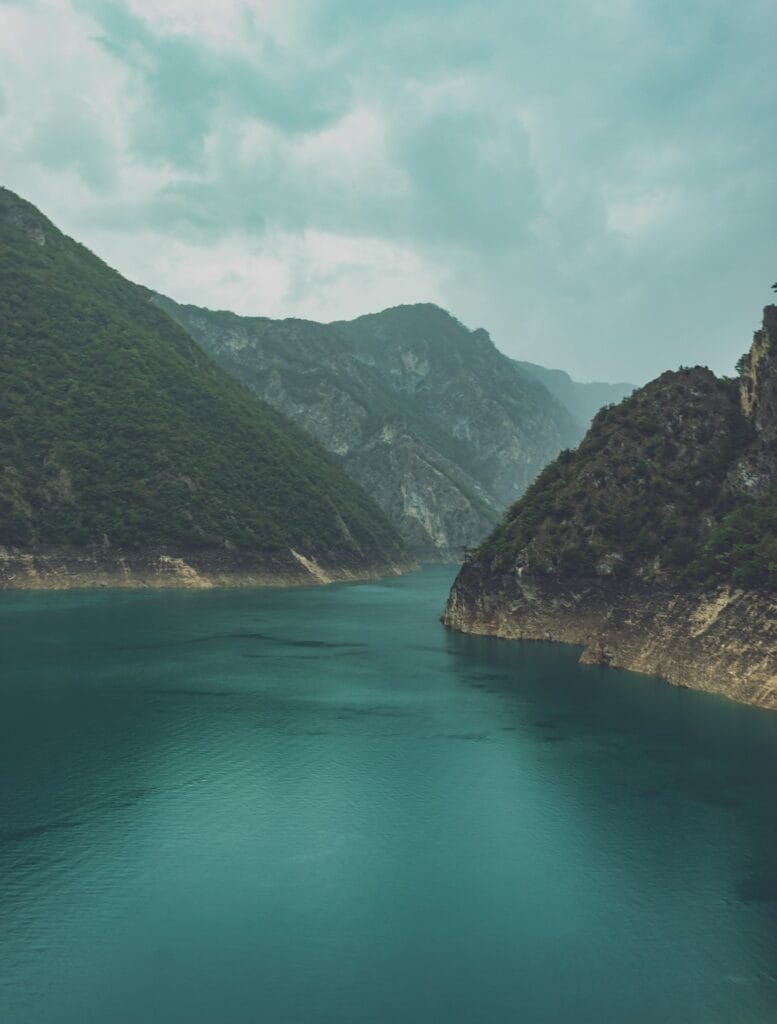 a large body of water surrounded by mountains