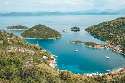 an aerial view of a bay surrounded by mountains