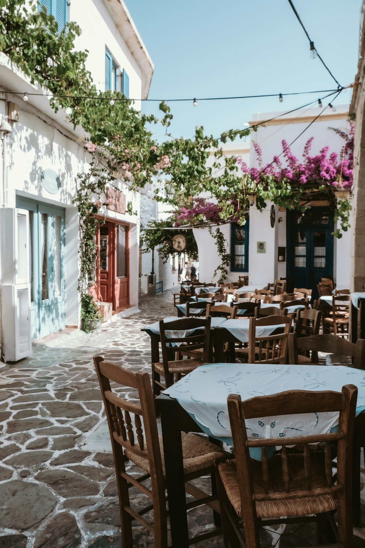 An outdoor dining area with tables and chairs