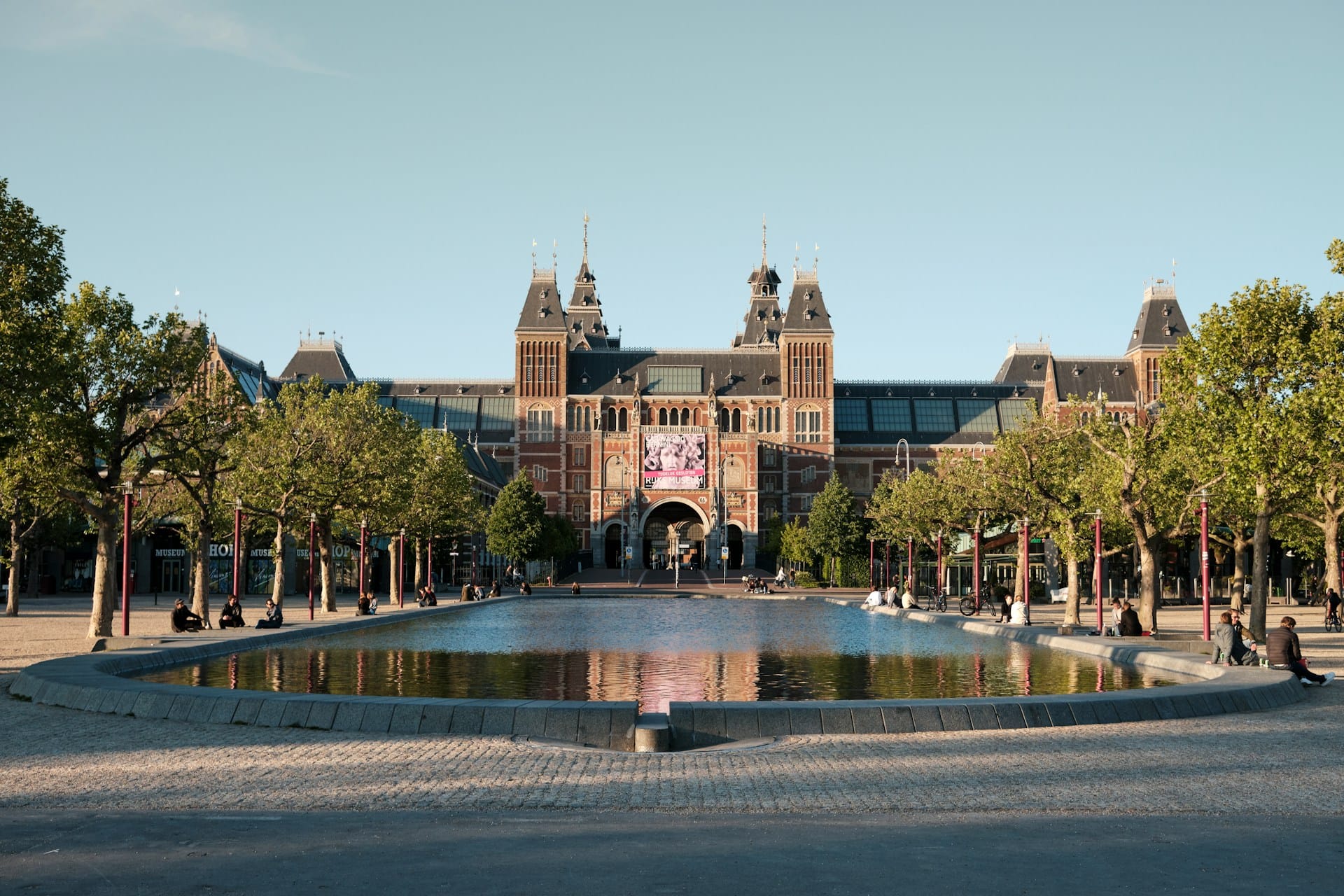 people walking on park near brown building during daytime