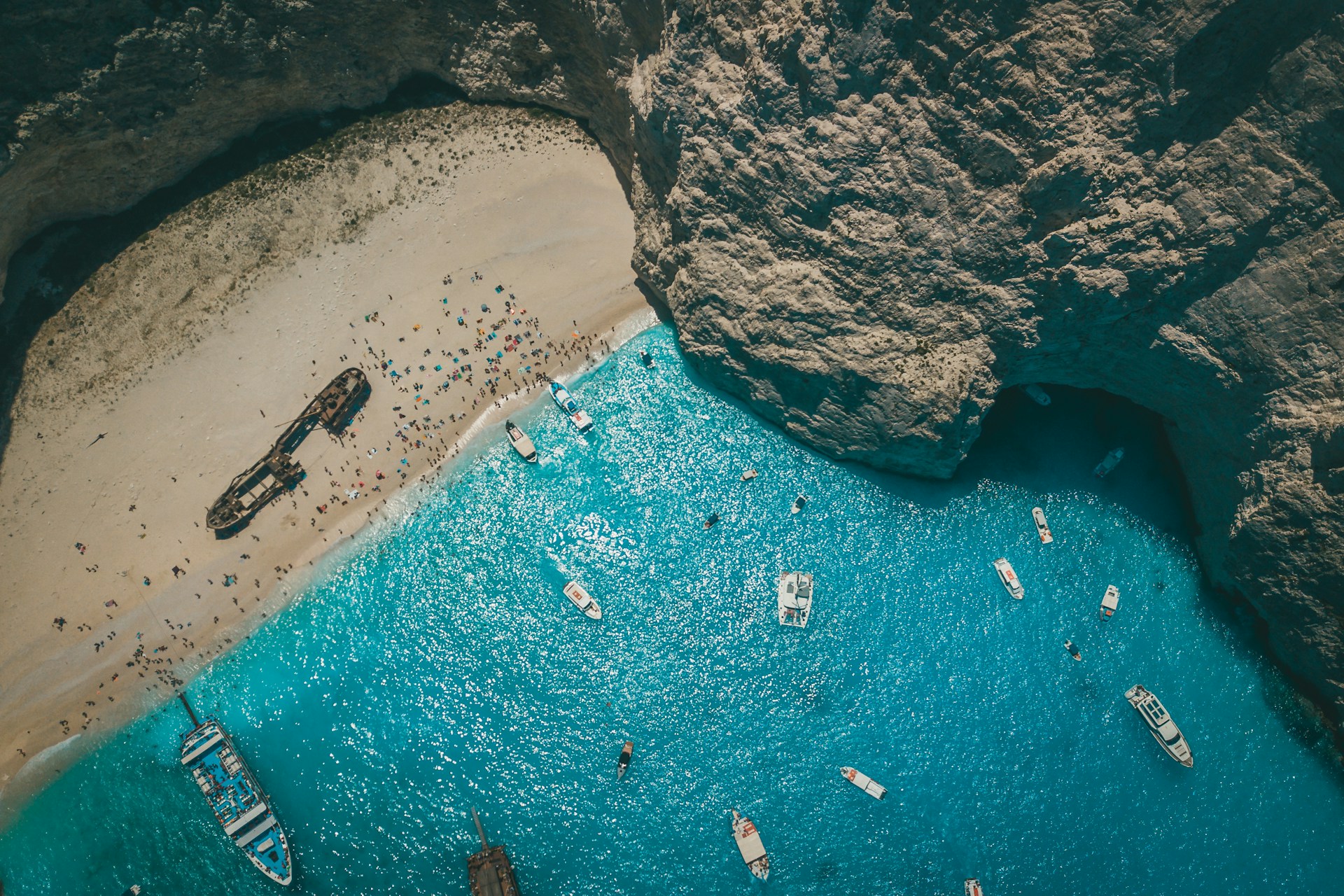 aerial view of boats on sea shore during daytime