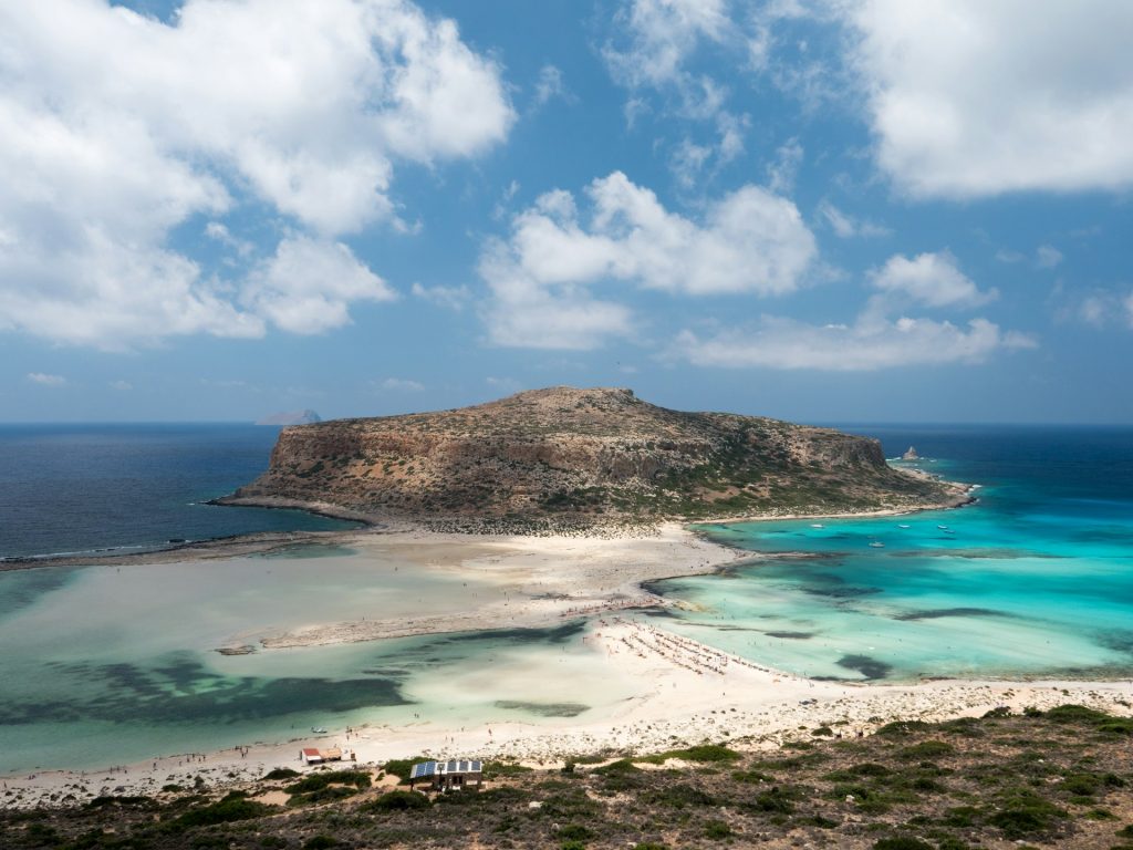 aerial shot of shore under blue sky