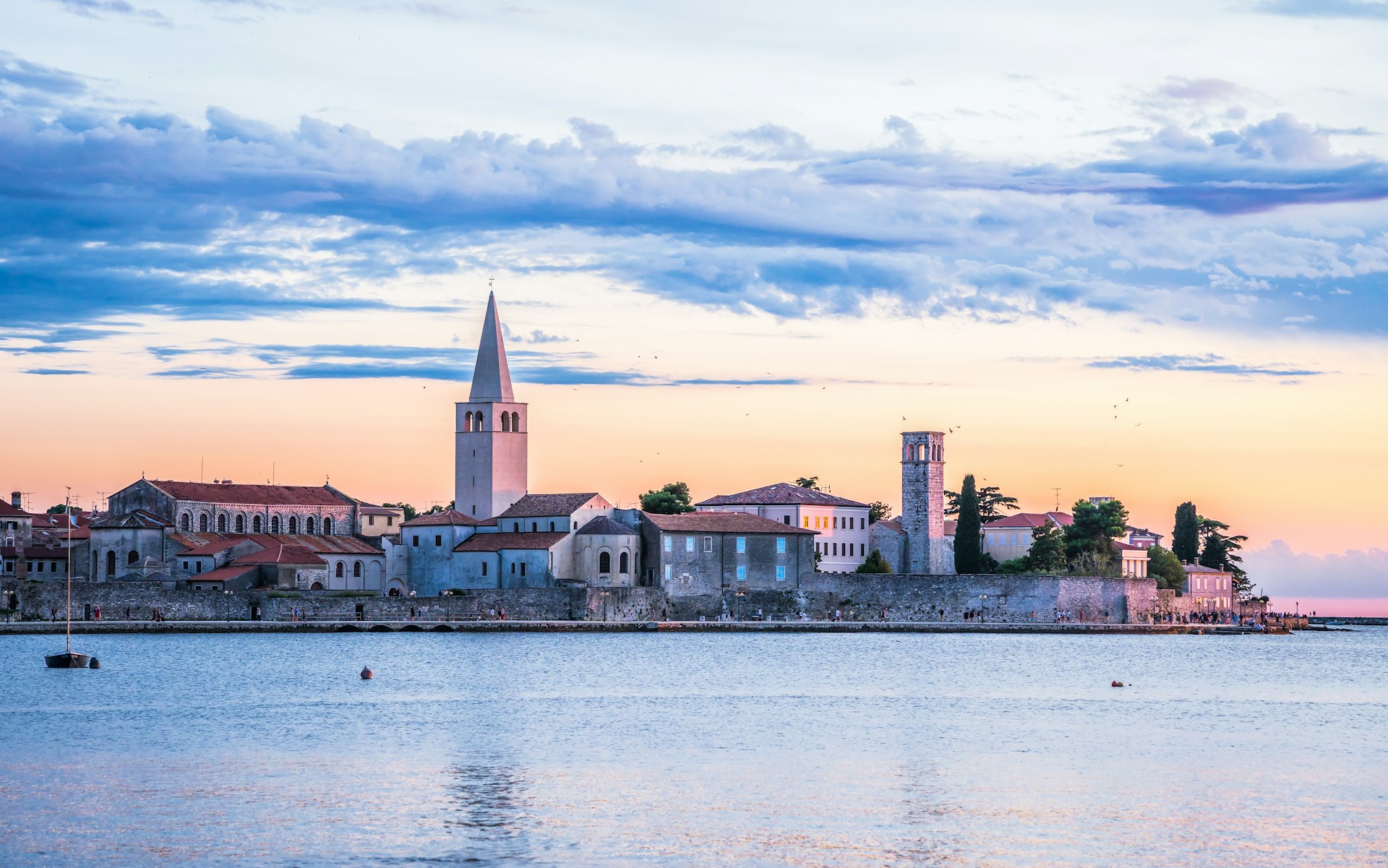 a large body of water with a city in the background
