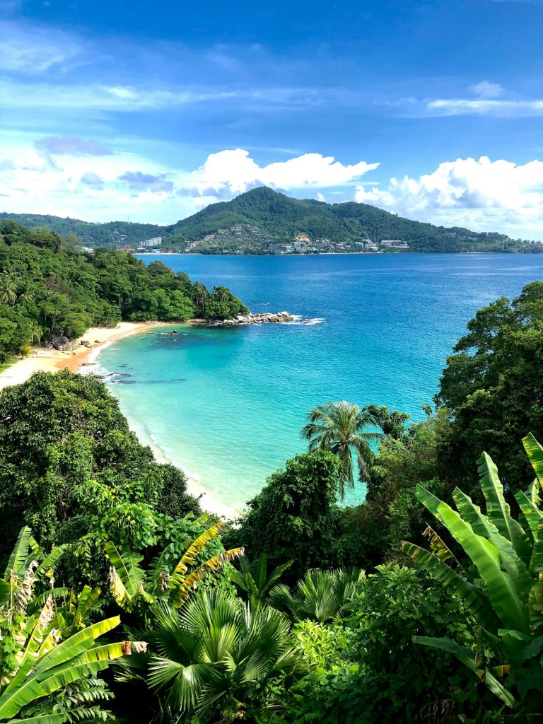 a view of a tropical beach from a hill