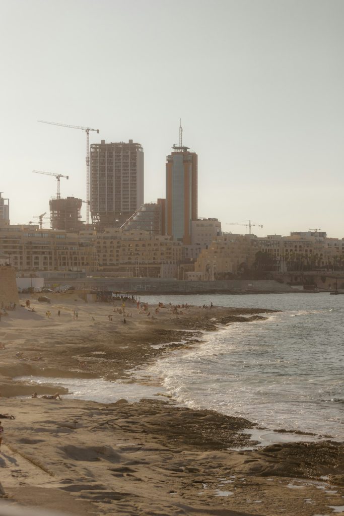 a beach with buildings in the background