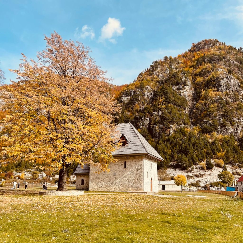 a small house in the middle of a field