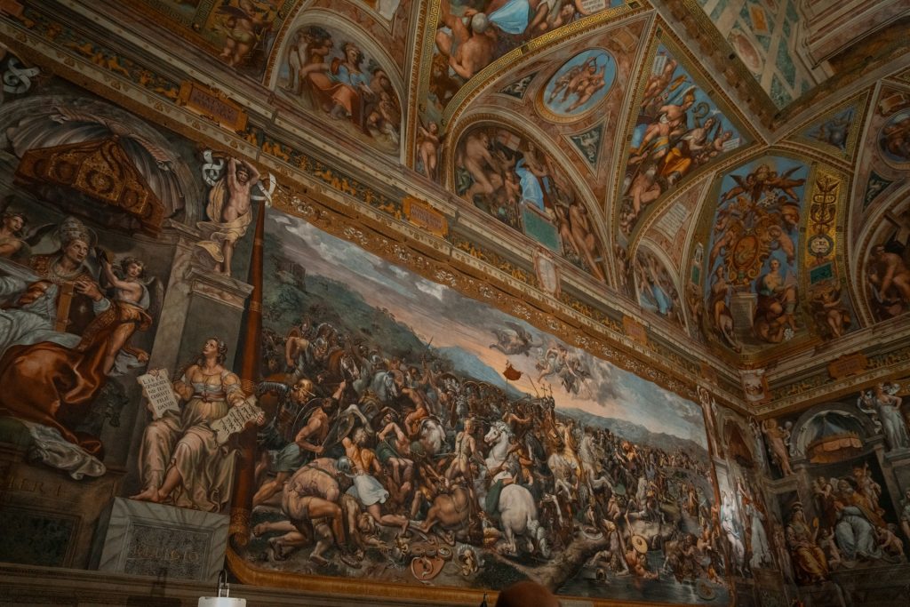 a large painting on the ceiling of a building