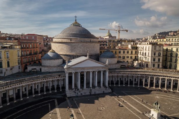 an aerial view of a large building with a dome
