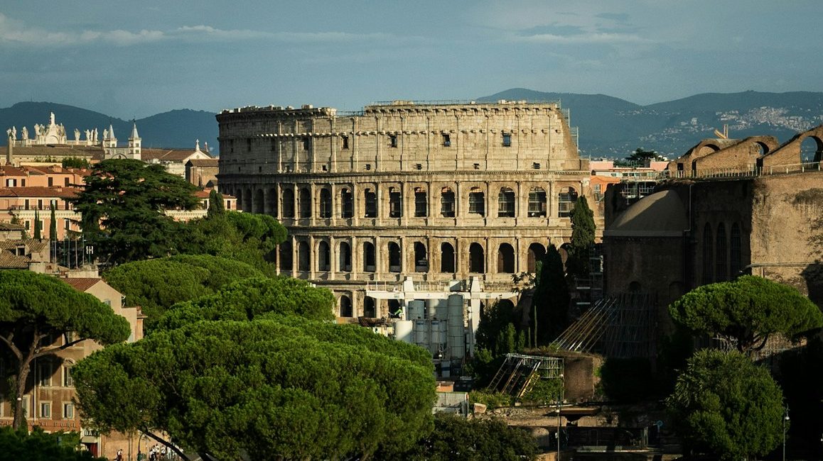 a large building with trees in front of it