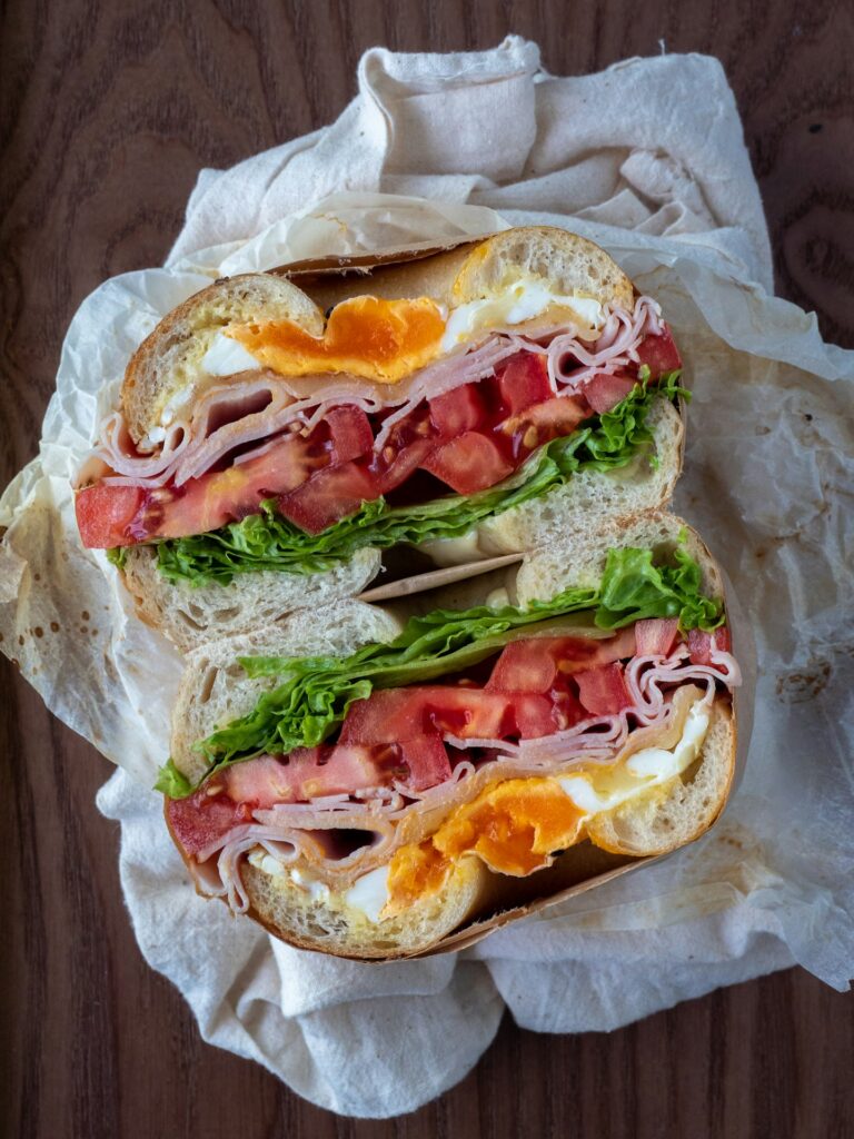 ham sandwich on white paper