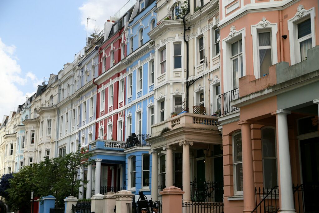 a row of multicolored buildings on a city street