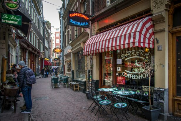 a sidewalk with tables and chairs on it